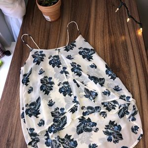 Spaghetti strap flowy blouse.